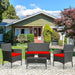 4 Piece Red Patio Rattan Sofa Set with Cushions & Glass Table arranged in a cozy front yard setting, complete with cushions and decorative elements, perfect for lounge and entertainment.