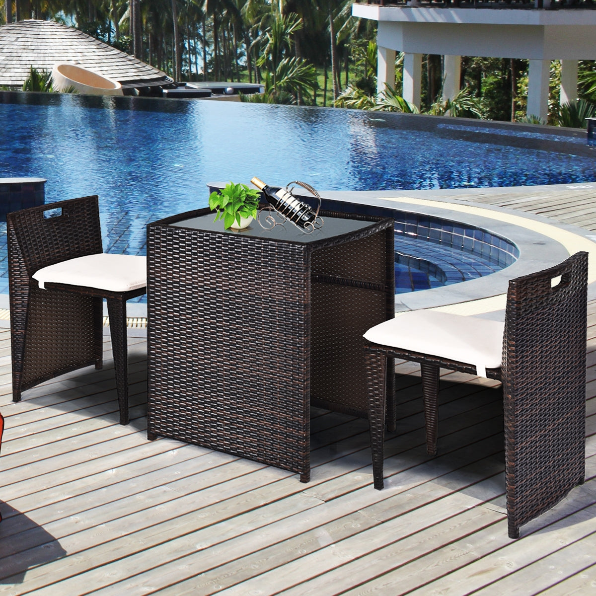 3-Piece Outdoor Wicker Patio Set with Cushions, No Assembly, Space-Saving Glass Table next to a pool, featuring two sleek chairs and a stylish table.