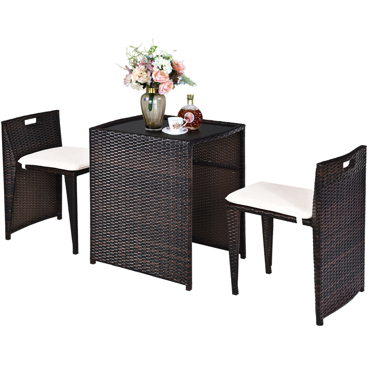 3-Piece Outdoor Wicker Patio Set with Cushions, No Assembly, Space-Saving Glass Table with a floral arrangement on the table, featuring two elegant chairs.
