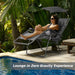 Woman lounging in a Folding Recliner Lounge Chair with Adjustable Shade Canopy & Cup Holder by Dream Yard Oasis, enjoying a zero gravity experience by the pool.