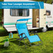 Folding Recliner Lounge Chair With Adjustable Shade Canopy & Cup Holder set up outside a camper, emphasizing its lightweight and portable design for easy transportation.