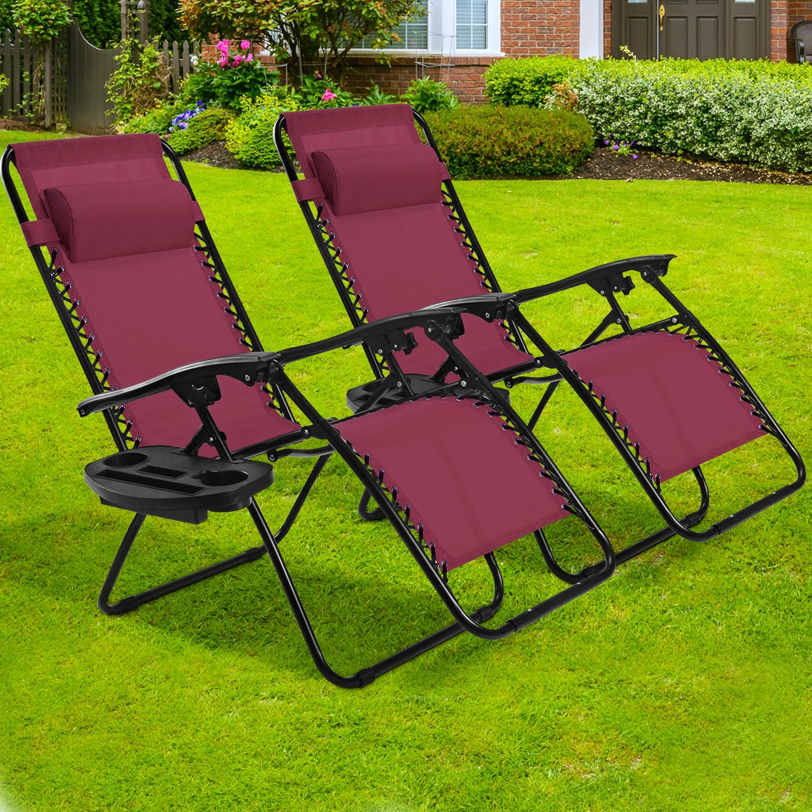 Two 2-Piece Wine Zero Gravity Folding Lounge Chairs positioned on a green lawn, perfect for outdoor lounging and social gatherings.