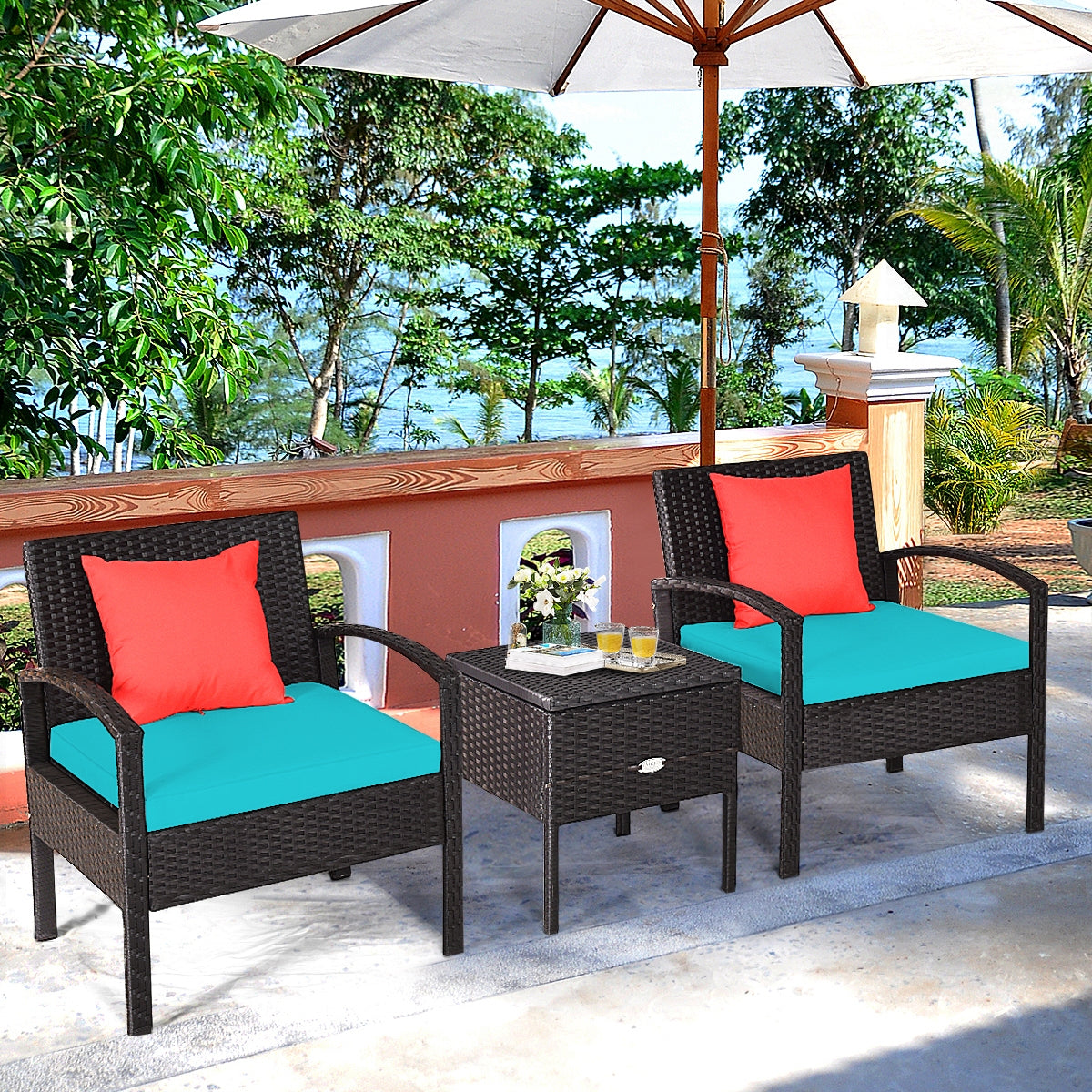 3-Piece Turquoise PE Rattan Wicker Sofa Set with Washable Cushions for Patio & Outdoor Use, situated under an umbrella by the water, perfect for enjoying outdoor leisure time.