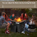 Group of friends enjoying the warm ambiance of the 28 Inch Propane Gas Fireplace during a gathering, showcasing how the fire pit enhances outdoor experiences with Dream Yard Oasis ™.