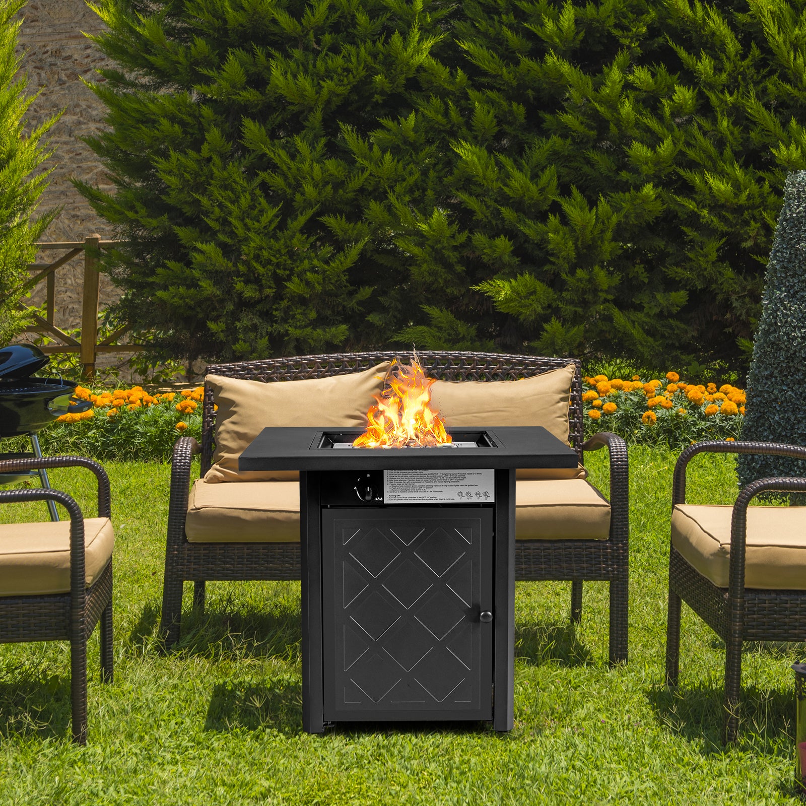 28 Inch Propane Gas Fireplace in action with flames, showcasing its 50,000 BTU heating capability in a garden setting with comfortable seating.