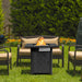 28 Inch Propane Gas Fireplace in action with flames, showcasing its 50,000 BTU heating capability in a garden setting with comfortable seating.