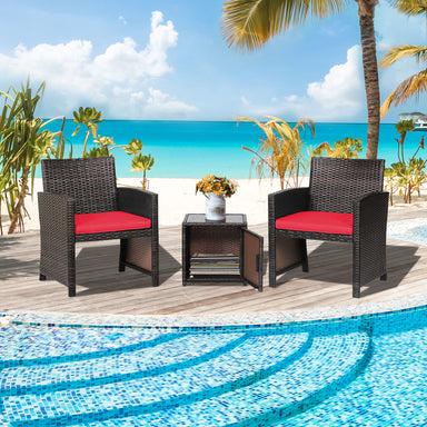 3-Piece Red Patio Wicker Furniture Set by Dream Yard Oasis, set up by the pool with a beautiful beach backdrop, showcasing the black wicker chairs and storage table.