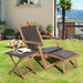 2 Pieces Patio Rattan Folding Lounge Chair with Acacia Wood Table displayed in an outdoor garden setting, featuring pink flowers and a book on the side table.