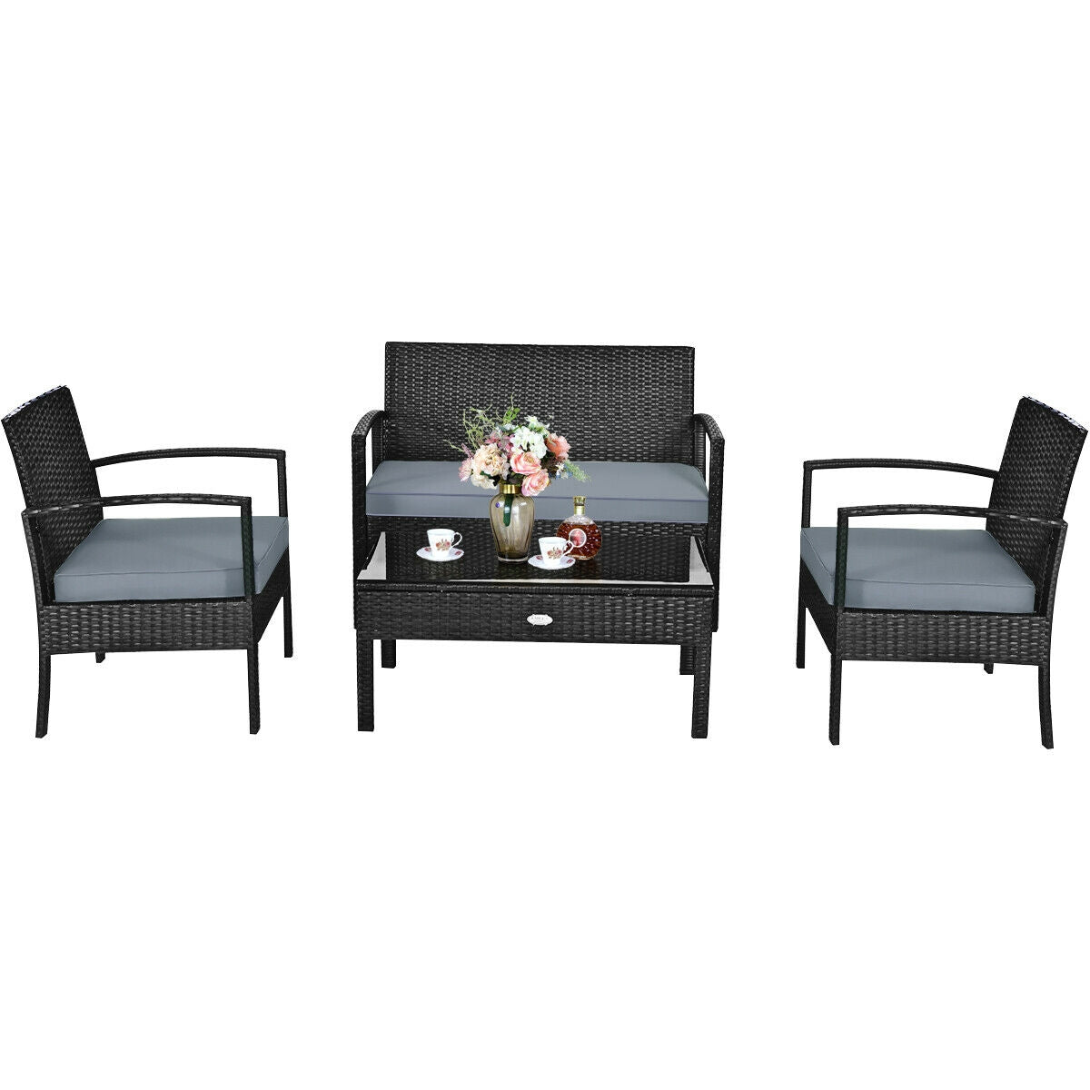 4-Piece Black Patio Rattan Furniture Set with Loveseat, Coffee Table & Cushions with added floral arrangements, showcasing stylish seating options.
