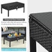 Stylish coffee table from the 4-Piece Black Patio Rattan Furniture Set, showcasing a practical tempered glass tabletop perfect for drinks and décor.