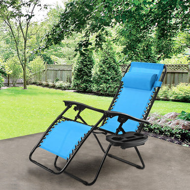 Light Blue Zero Gravity Folding Lounge Chair with Headrest & Cup Holder, ideal for outdoor relaxation in a green backyard setting.