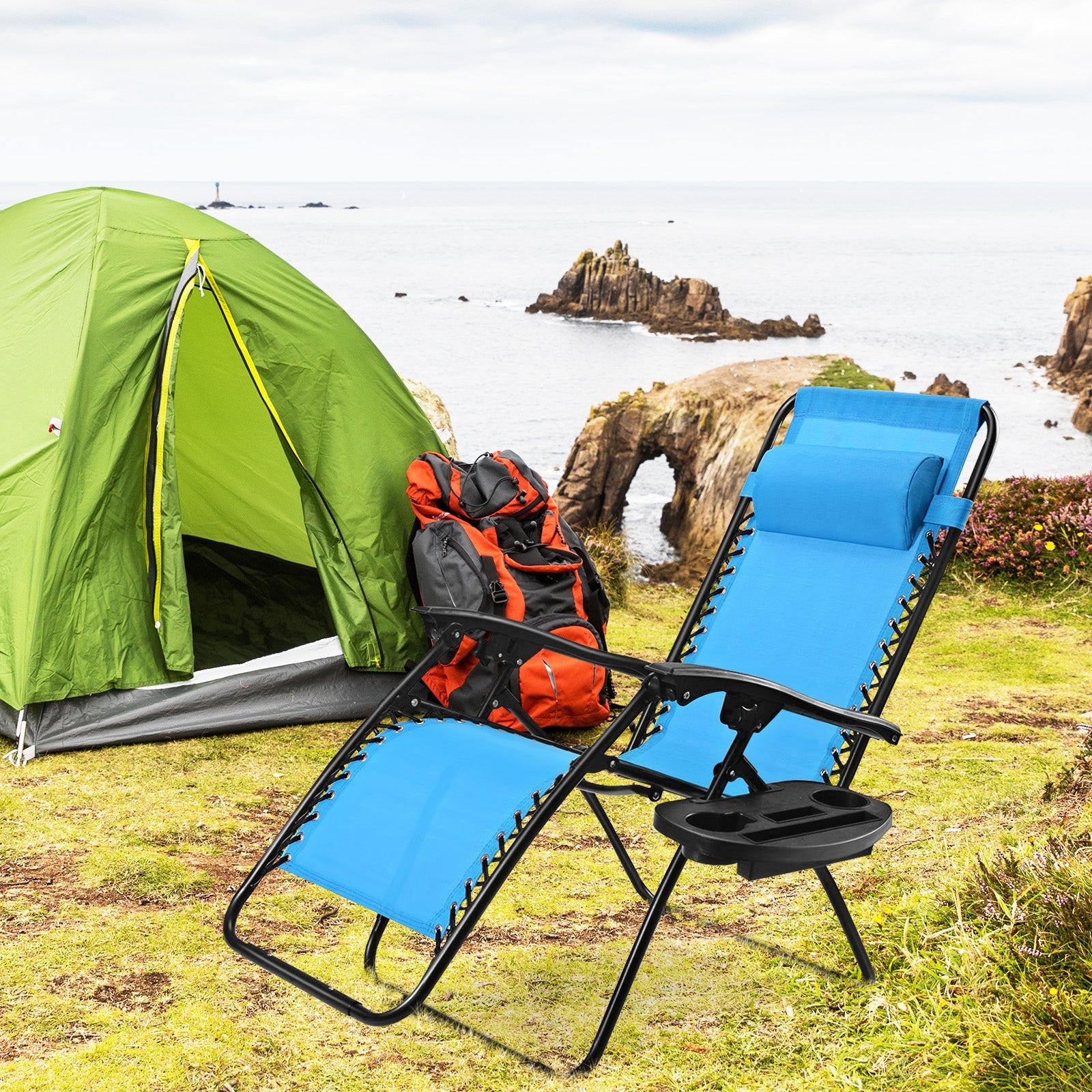 Light Blue Zero Gravity Folding Lounge Chair with Headrest & Cup Holder set up at a campsite, ideal for outdoor adventures.