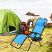 Light Blue Zero Gravity Folding Lounge Chair with Headrest & Cup Holder set up at a campsite, ideal for outdoor adventures.