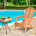 Eucalyptus Foldable Outdoor Adirondack Chair with Ergonomic Design and Comfort for Patio, Deck, Garden beside a pool with a breakfast spread.