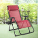 Oversize Heavy Duty Folding Recliner Lounge Chair with Cup Holder by Dream Yard Oasis in wine color, set outdoors with green foliage in the background, ideal for relaxing and enjoying the sun.
