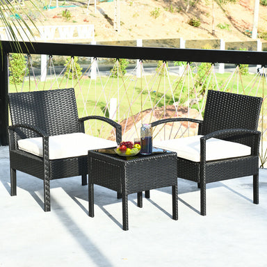 3 Piece Outdoor Rattan Sofa Set with Cushions and Glass Table for Patio and Garden arranged on a balcony with drinks and fruit, perfect for outdoor entertaining.