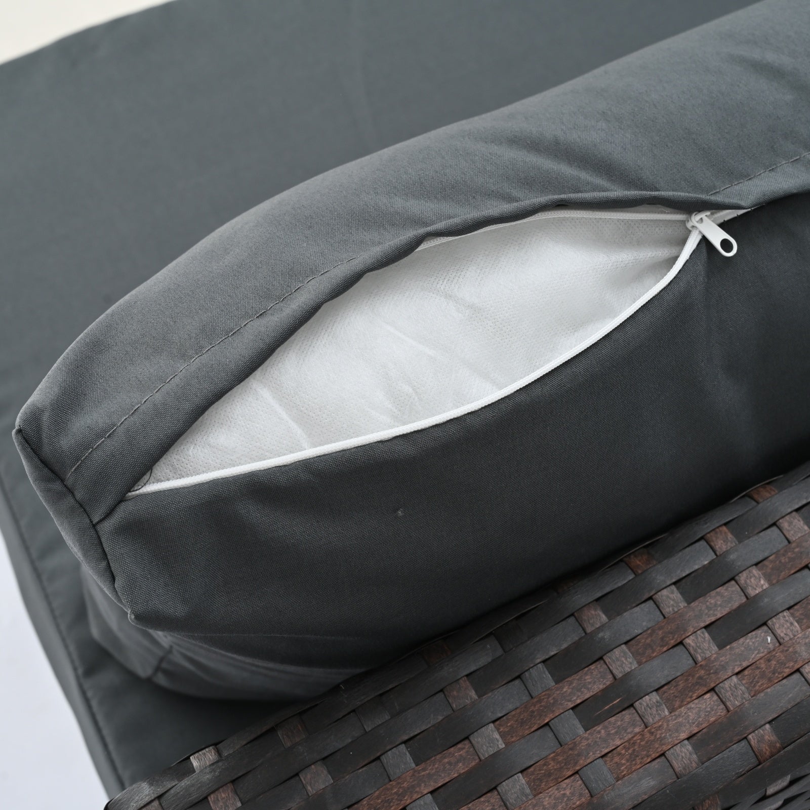 Close-up of the cushion detail from Dream Yard Oasis™ 5-Piece Brown PE Wicker Patio Furniture Set for 4, featuring zippered covers for easy cleaning.