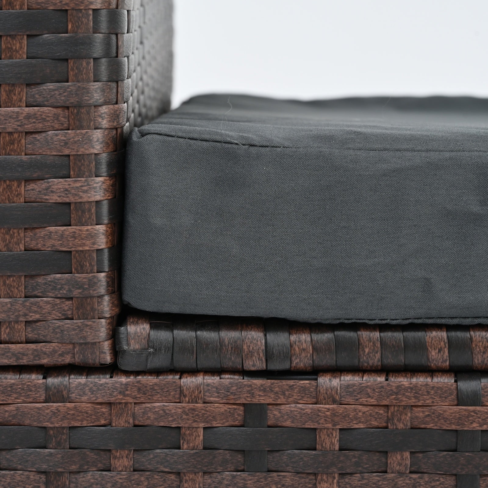 Detail shot of the wicker material used in the Dream Yard Oasis™ 5-Piece Brown PE Wicker Patio Furniture Set for 4, highlighting its sturdy construction.