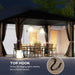 Outsunny 10' x 12' Hardtop Gazebo illuminated at night, showcasing the top hook ideal for hanging lights, with a cozy outdoor dining setup.