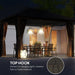 Outsunny 10' x 12' Hardtop Gazebo with Aluminum Frame, Steel Roof & Mesh Netting by Dream Yard Oasis, featuring a cozy evening setup with lighting options, perfect for outdoor entertaining.