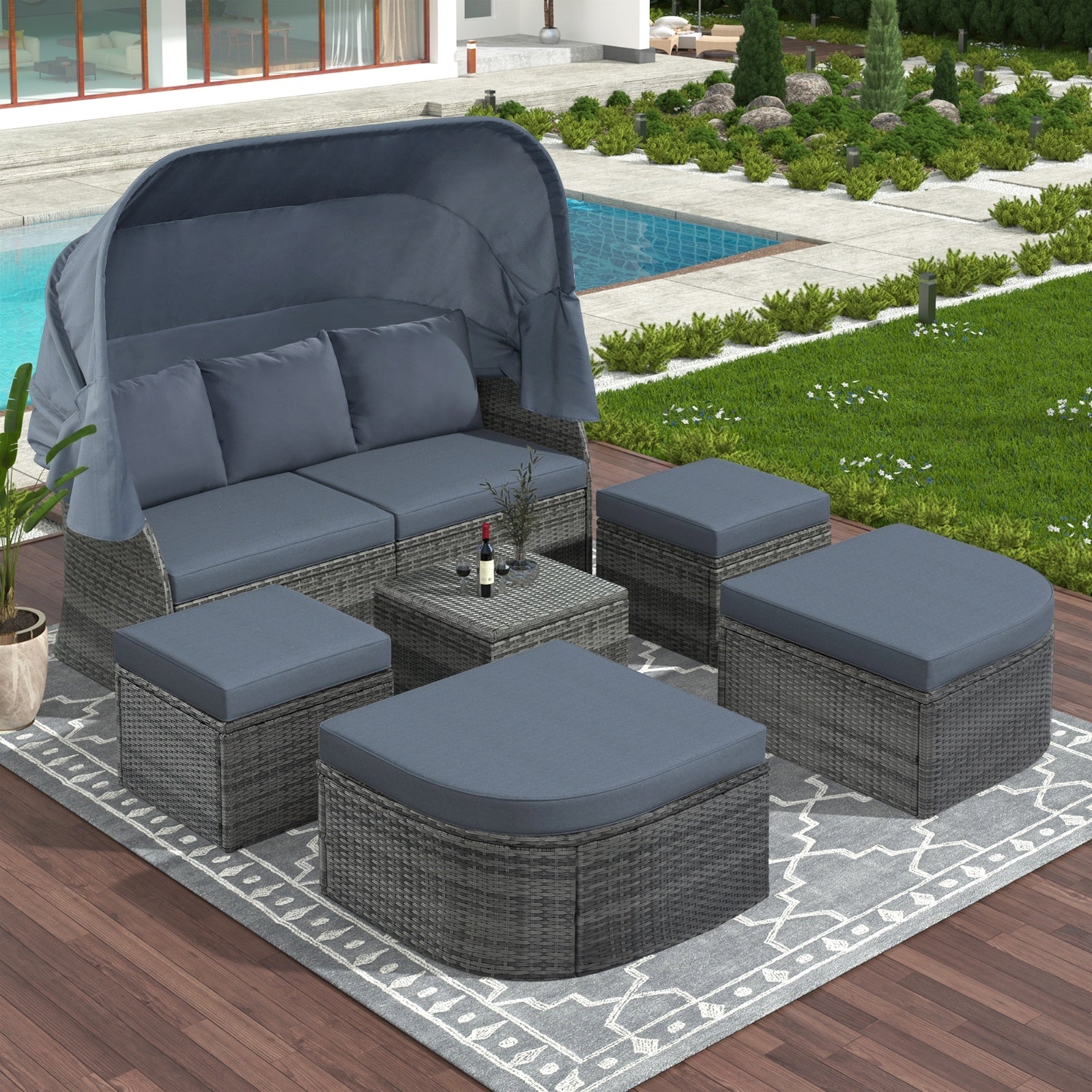 Outdoor patio scene featuring the complete U STYLE Outdoor Wicker Daybed Sunbed Set with Canopy by Dream Yard Oasis, surrounded by greenery and a pool.