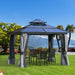 The Outsunny 10'X10' Hardtop Aluminum Patio Gazebo set in a scenic outdoor location with a dining table, demonstrating its perfect fit for outdoor gatherings.