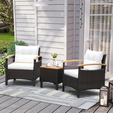 3-Piece Outdoor Patio Rattan Furniture Set with Removable Cushions - Stylish & Comfortable featuring two stylish chairs and a coffee table on a wooden patio.