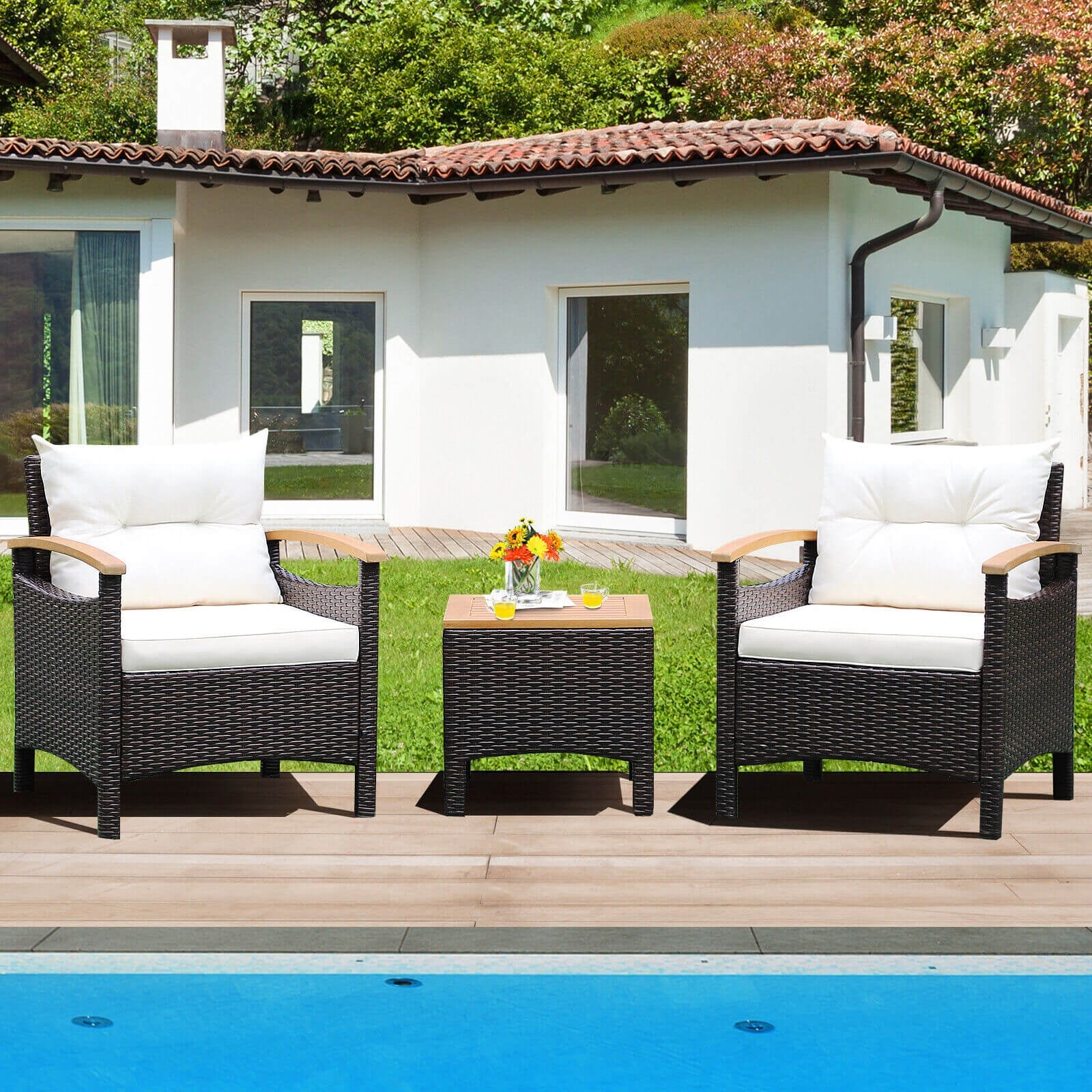 Stylish setup of the 3-Piece Outdoor Patio Rattan Furniture Set with Removable Cushions by Dream Yard Oasis beside a pool, showcasing two comfortable chairs and a wood-topped side table.