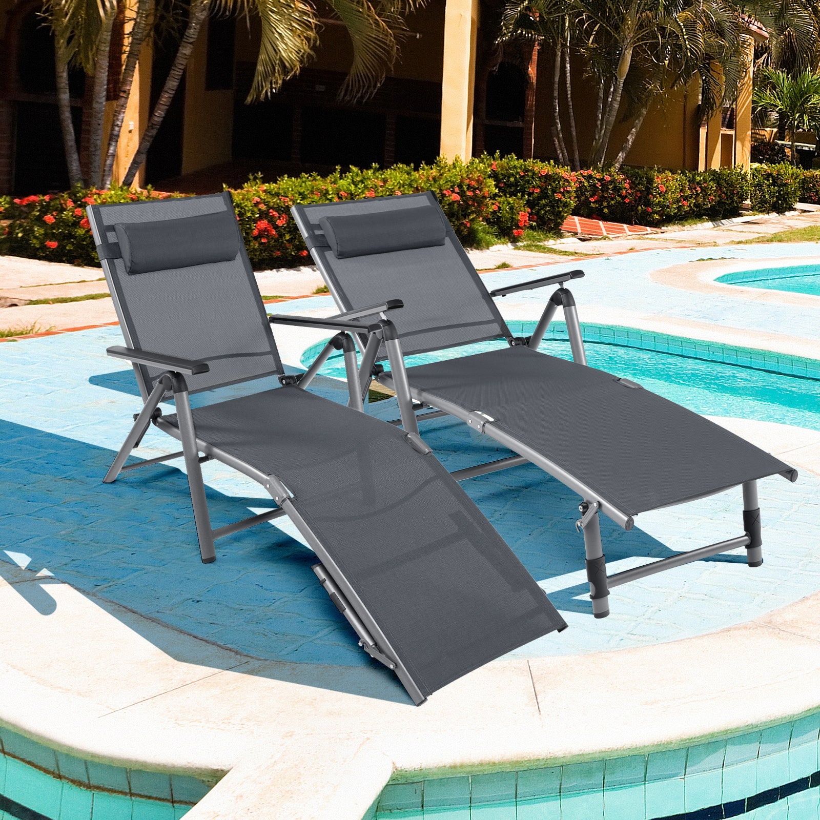 Two Adjustable Outdoor Aluminum Chaise Lounge Chairs with Quick-Drying Fabric & Removable Pillow set beside a swimming pool, perfect for sunbathing.