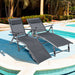 Two Adjustable Outdoor Aluminum Chaise Lounge Chairs with Quick-Drying Fabric & Removable Pillow set beside a swimming pool, perfect for sunbathing.