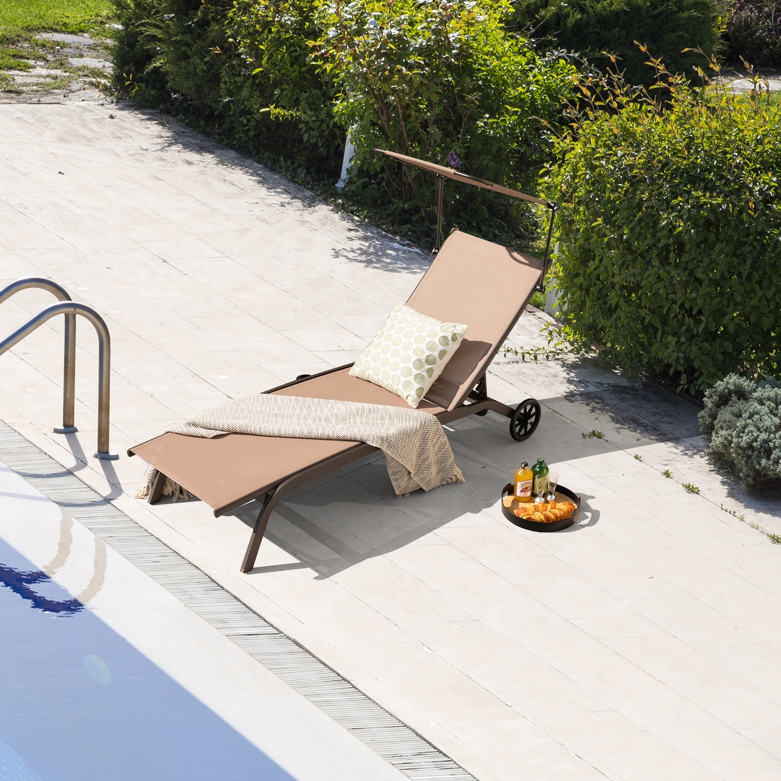 Heavy-Duty Adjustable Chaise Lounge Chair with Canopy & Cup Holder featuring a brown fabric seat by the poolside, adorned with a decorative pillow and a cozy throw blanket, perfect for leisure and relaxation.