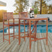 3-Piece Acacia Wood Patio Bar Set with Sunflower Backrest featuring a stylish table and comfortable stools by Dream Yard Oasis, perfect for outdoor gatherings next to a pool.