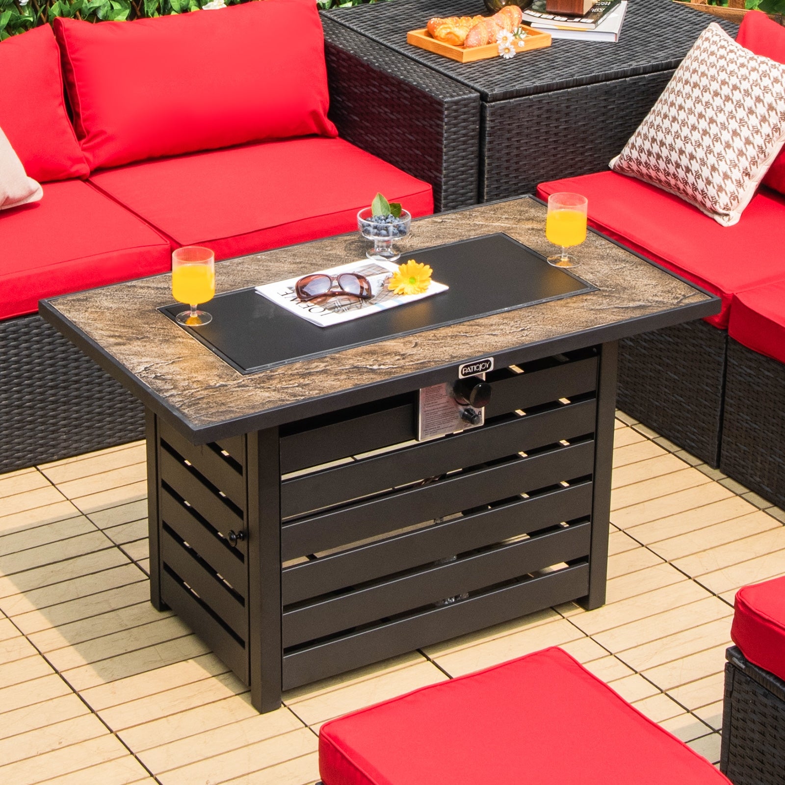 42-Inch Propane Fire Pit Table showcasing its stylish design and functionality in an outdoor setting, perfect for cozy gatherings with a 50,000 BTU heat output.