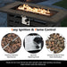 Close-up of the Dream Yard Oasis™ 42-Inch Propane Fire Pit Table showing easy ignition system, flame control knob, and lava rocks for even heat distribution.