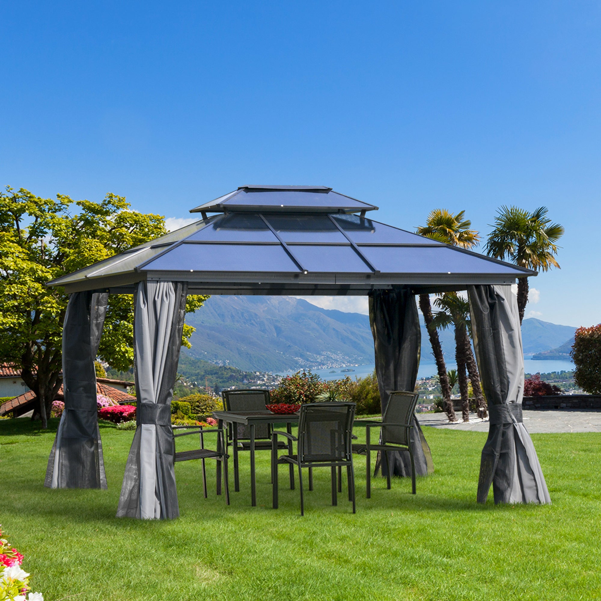 Outsunny 10'X12' Hardtop Gazebo set up outdoors in a garden, with chairs and a table underneath, featuring a scenic backdrop.