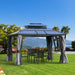 Outsunny 10'X12' Hardtop Gazebo set up outdoors in a garden, with chairs and a table underneath, featuring a scenic backdrop.