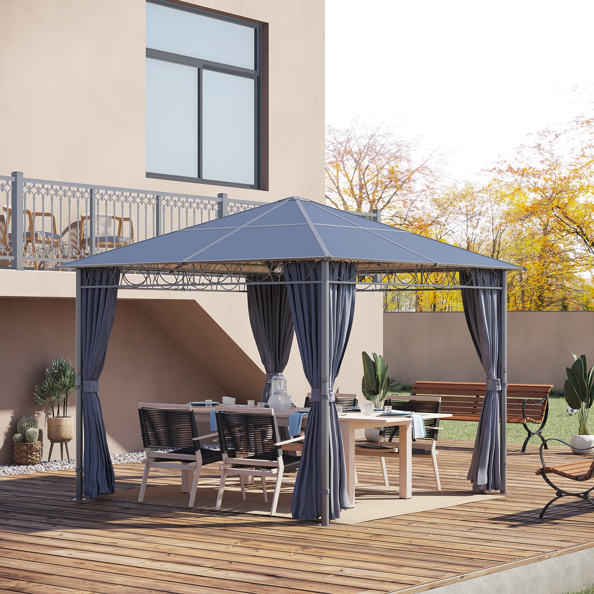 View of the Outsunny 10'x10' Hardtop Gazebo set up in a backyard, featuring a spacious dining area with a table and chairs under the elegant canopy.