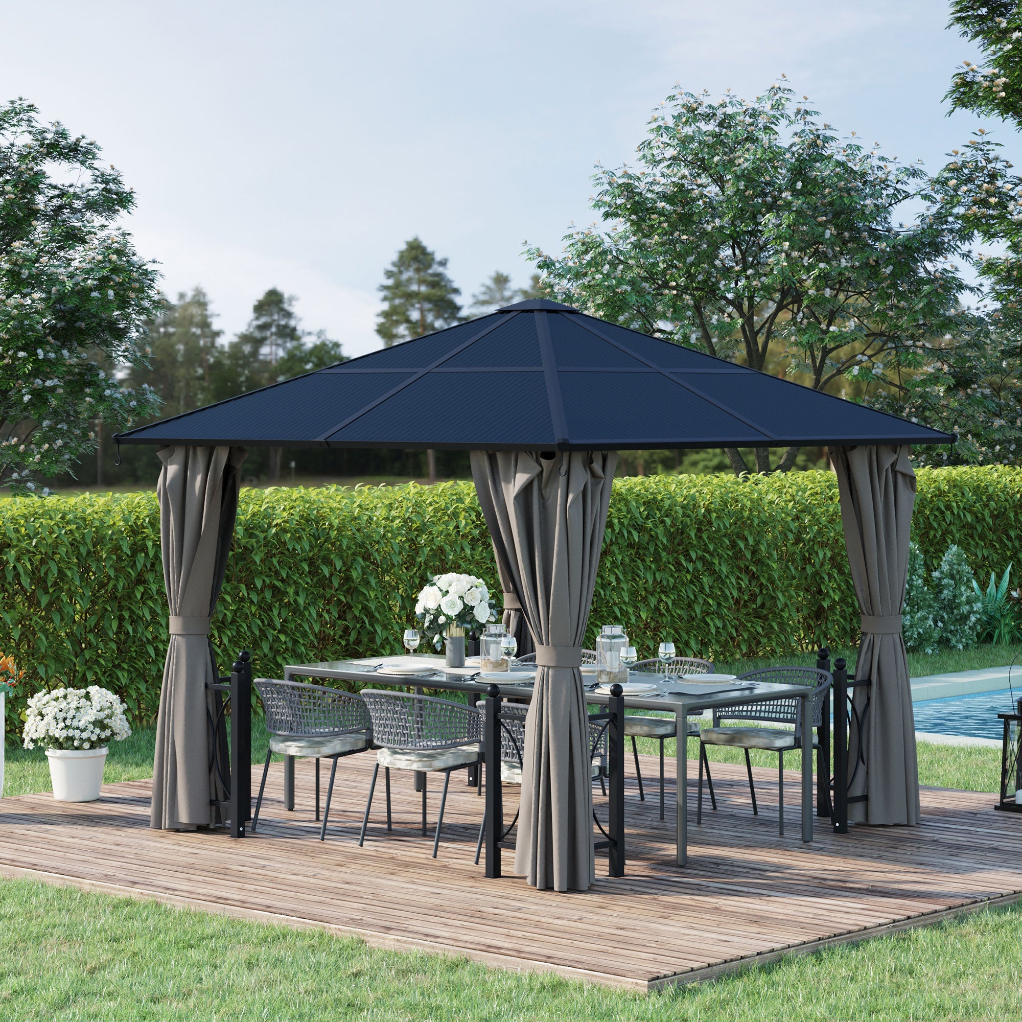 Outsunny 10'X10' Hardtop Gazebo set up in a stylish outdoor area with a cozy seating arrangement, perfect for outdoor gatherings and relaxation.