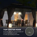 Nighttime view of the Outsunny 10' x 12' Double-Tier Hardtop Gazebo highlighting the top center hook designed for hanging lights or a heater, creating an inviting atmosphere.